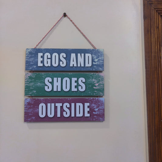 Three steps wooden plates with a quotation Ego and shoes outside for your room